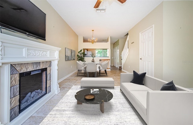 1241 Redondo Way, Wesley Chapel, FL 33543 - living area with a chandelier, a tile fireplace, and a ceiling fan