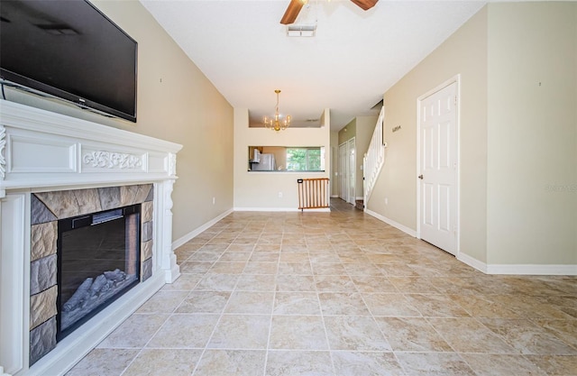 1241 Redondo Way, Wesley Chapel, FL 33543 - unfurnished living room featuring a chandelier, ceiling fan, and a tile fireplace