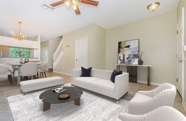 1241 Redondo Way, Wesley Chapel, FL 33543 - tiled living room with stairway, a chandelier, and a ceiling fan
