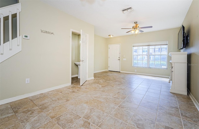 1241 Redondo Way, Wesley Chapel, FL 33543 - unfurnished living room with a ceiling fan and stairway