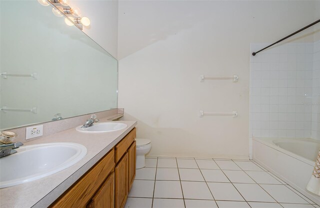 1241 Redondo Way, Wesley Chapel, FL 33543 - bathroom featuring double vanity,  shower combination, and tile patterned floors