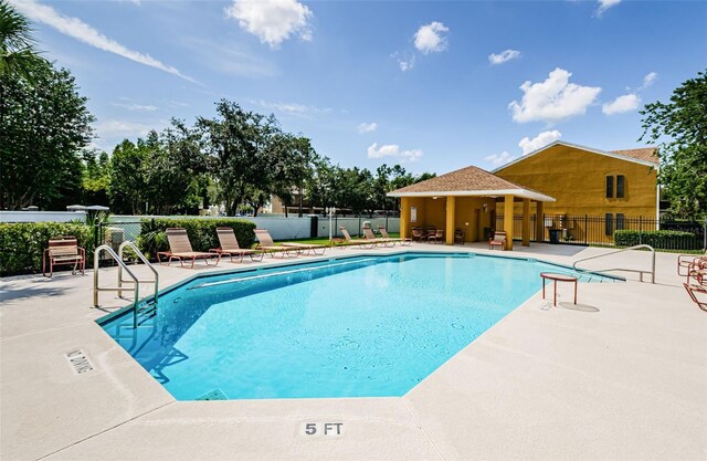 1241 Redondo Way, Wesley Chapel, FL 33543 - community pool with a patio area