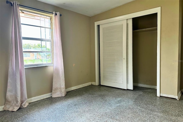5016 S 86th St, Tampa, FL 33619 - unfurnished bedroom with a closet and speckle patterned floor