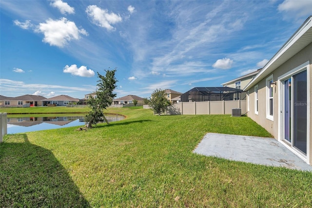 30732 Summer Sun Loop, Wesley Chapel, FL 33545 - view of grassy yard with a residential view, a water view, and a patio area