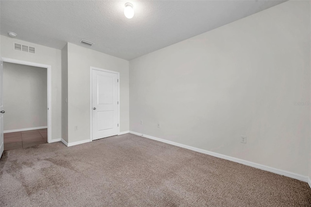 30732 Summer Sun Loop, Wesley Chapel, FL 33545 - unfurnished bedroom with carpet and a textured ceiling