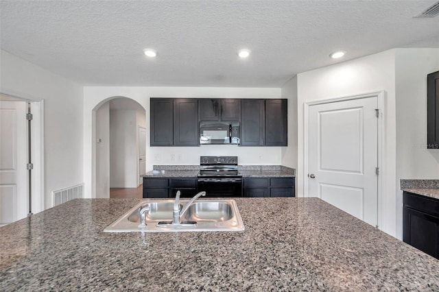 30732 Summer Sun Loop, Wesley Chapel, FL 33545 - kitchen featuring black appliances, arched walkways, and recessed lighting