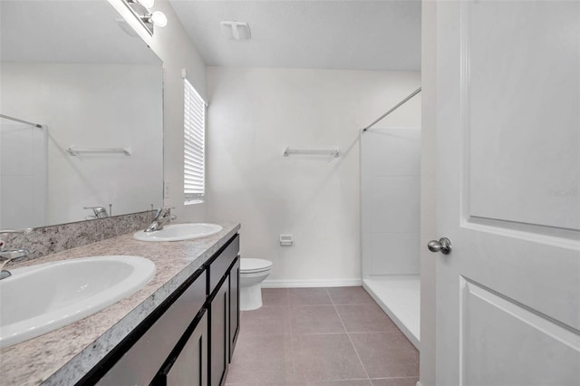 30732 Summer Sun Loop, Wesley Chapel, FL 33545 - bathroom with a shower, double vanity, and tile patterned floors