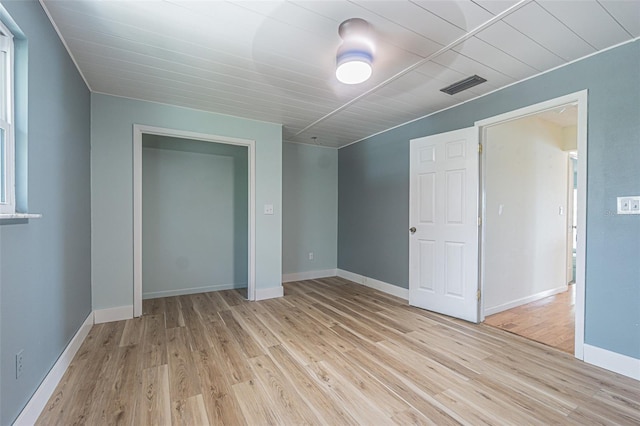 739 Chesapeake Dr, Tarpon Springs, FL 34689 - unfurnished bedroom featuring light wood finished floors