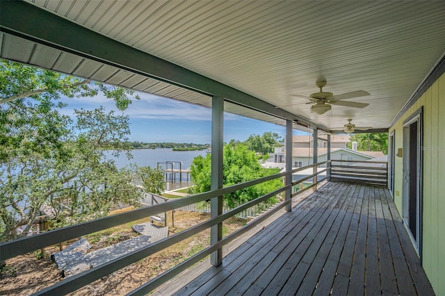 739 Chesapeake Dr, Tarpon Springs, FL 34689 - wooden terrace with a water view and ceiling fan