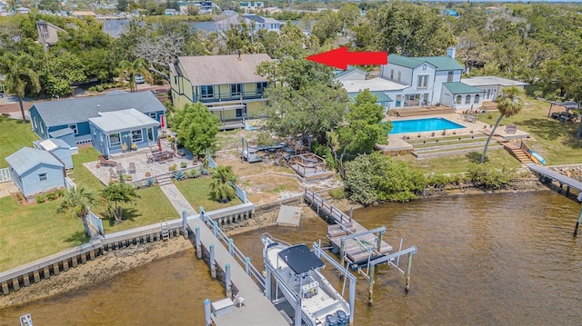739 Chesapeake Dr, Tarpon Springs, FL 34689 - view of subject property with a pool and a large body of water