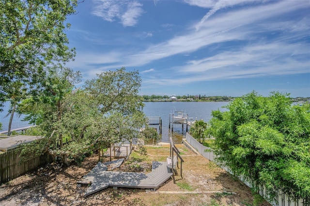 739 Chesapeake Dr, Tarpon Springs, FL 34689 - view of yard featuring a water view and a boat dock