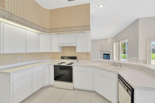 11908 Pilot Country Dr, Spring Hill, FL 34610 - kitchen with white electric range oven, dishwashing machine, custom exhaust hood, a peninsula, and light countertops
