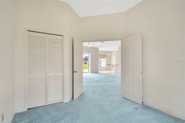 11908 Pilot Country Dr, Spring Hill, FL 34610 - unfurnished bedroom featuring light carpet, a chandelier, and a closet