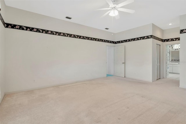 11908 Pilot Country Dr, Spring Hill, FL 34610 - unfurnished bedroom featuring light carpet, ensuite bathroom, recessed lighting, and a ceiling fan