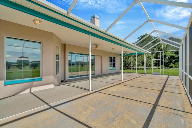 11908 Pilot Country Dr, Spring Hill, FL 34610 - view of patio / terrace with ceiling fan and glass enclosure