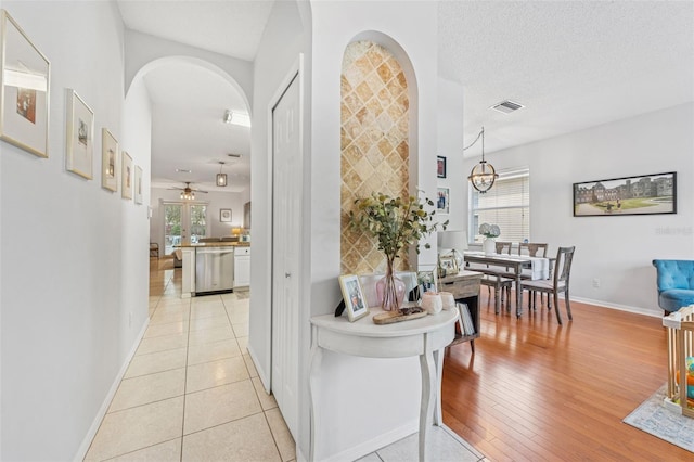 10409 Glen Willow Ln, Tampa, FL 33647 - hall featuring arched walkways and light wood-type flooring