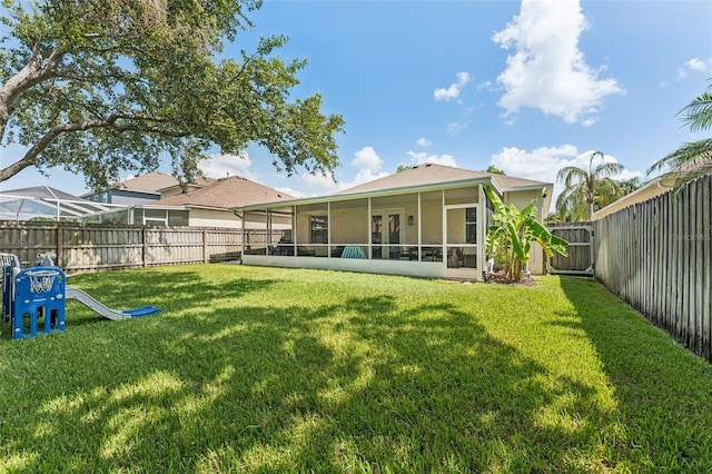 10409 Glen Willow Ln, Tampa, FL 33647 - back of property featuring a sunroom and a fenced backyard