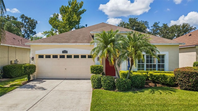 10409 Glen Willow Ln, Tampa, FL 33647 - view of front of property featuring a garage, stucco siding, driveway, a shingled roof, and a front lawn