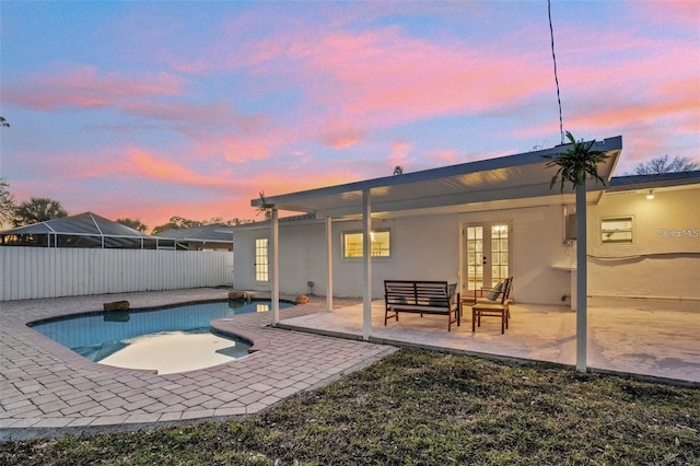 1320 Dixie Ln S, Saint Petersburg, FL 33707 - view of pool with french doors, a patio, and outdoor lounge area