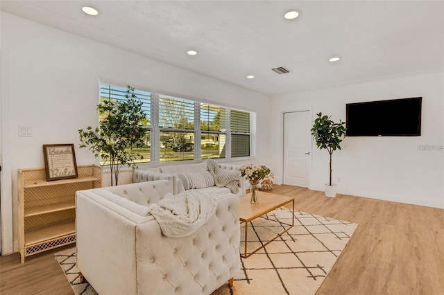 1320 Dixie Ln S, Saint Petersburg, FL 33707 - living area with light wood-style floors and recessed lighting