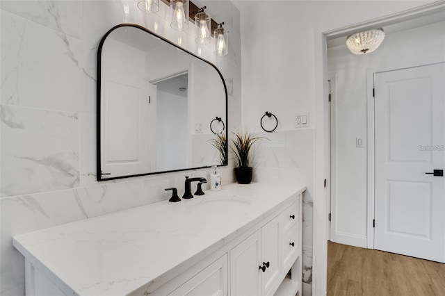 1320 Dixie Ln S, Saint Petersburg, FL 33707 - bathroom with vanity and wood finished floors