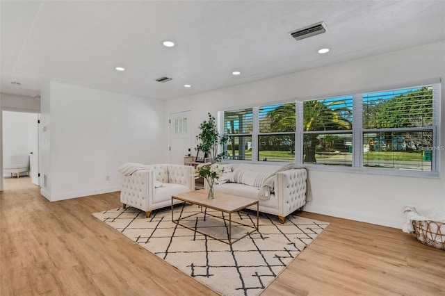1320 Dixie Ln S, Saint Petersburg, FL 33707 - living room with light wood-style flooring and recessed lighting