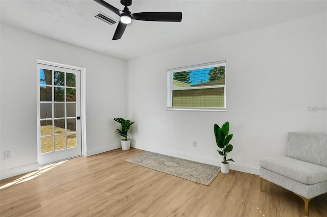 1320 Dixie Ln S, Saint Petersburg, FL 33707 - unfurnished room with wood finished floors and a ceiling fan