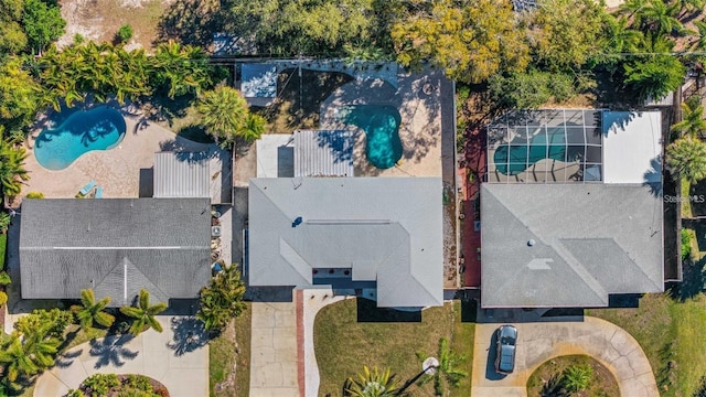 1320 Dixie Ln S, Saint Petersburg, FL 33707 - drone / aerial view of a pool area