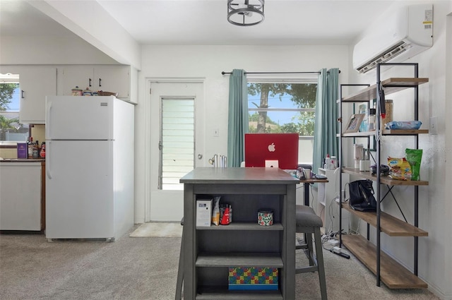 4917 99th St N, Saint Petersburg, FL 33708 - dining area with a wall mounted air conditioner, light carpet, and an office area