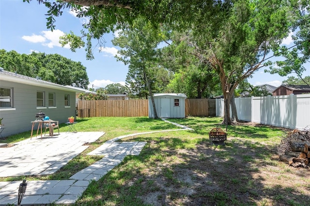 4917 99th St N, Saint Petersburg, FL 33708 - fenced backyard with an outdoor fire pit, a patio, and a storage unit