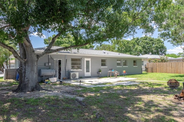 4917 99th St N, Saint Petersburg, FL 33708 - rear view of house featuring an outdoor fire pit and a patio