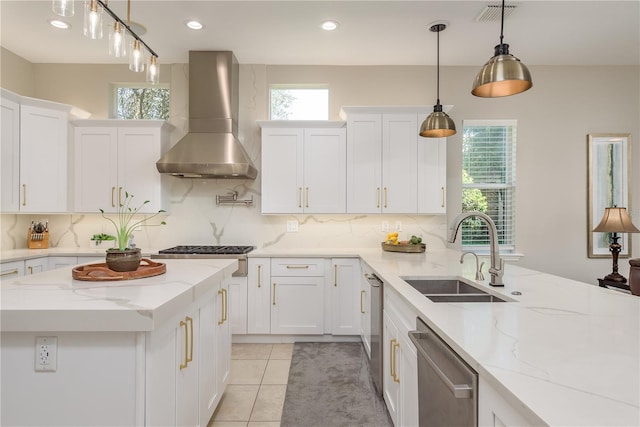 3042 Wentworth Way, Tarpon Springs, FL 34688 - kitchen featuring wall chimney exhaust hood, appliances with stainless steel finishes, white cabinetry, decorative backsplash, and recessed lighting