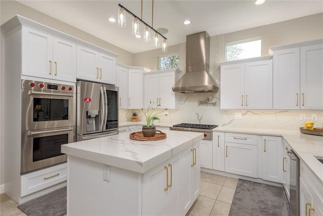 3042 Wentworth Way, Tarpon Springs, FL 34688 - kitchen with wall chimney exhaust hood, stainless steel appliances, white cabinetry, healthy amount of natural light, and recessed lighting