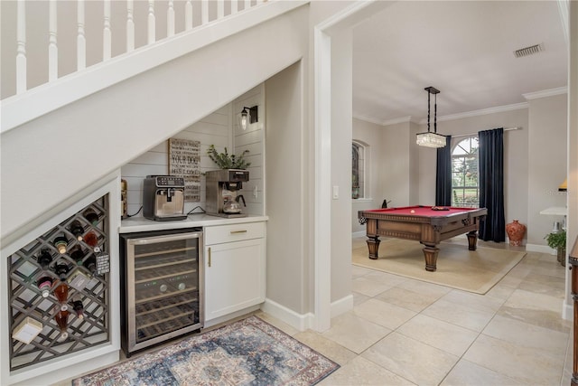 3042 Wentworth Way, Tarpon Springs, FL 34688 - indoor bar featuring wine cooler, crown molding, pool table, pendant lighting, and light tile patterned floors