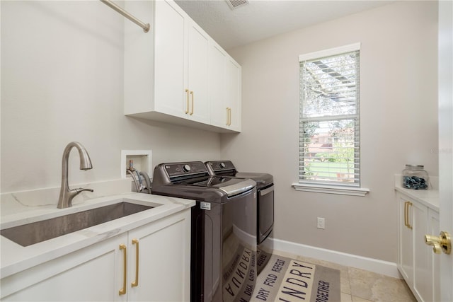 3042 Wentworth Way, Tarpon Springs, FL 34688 - laundry area with cabinet space and washer and clothes dryer