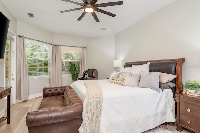 3042 Wentworth Way, Tarpon Springs, FL 34688 - bedroom with light wood-type flooring and ceiling fan