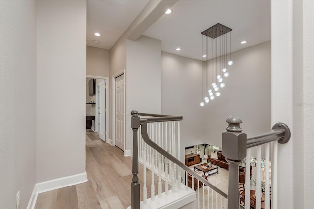 3042 Wentworth Way, Tarpon Springs, FL 34688 - hall featuring an upstairs landing, wood finished floors, and recessed lighting