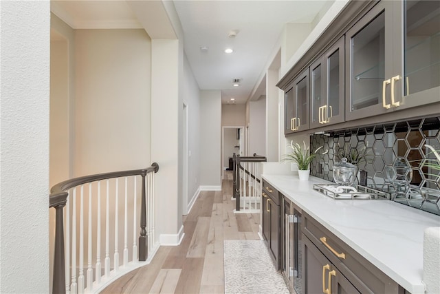 3042 Wentworth Way, Tarpon Springs, FL 34688 - corridor featuring light wood-type flooring, an upstairs landing, recessed lighting, and beverage cooler