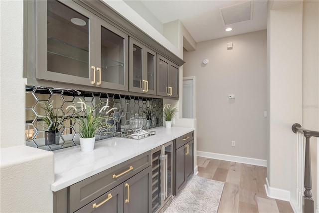 3042 Wentworth Way, Tarpon Springs, FL 34688 - bar area featuring wine cooler, tasteful backsplash, light wood-style floors, and recessed lighting