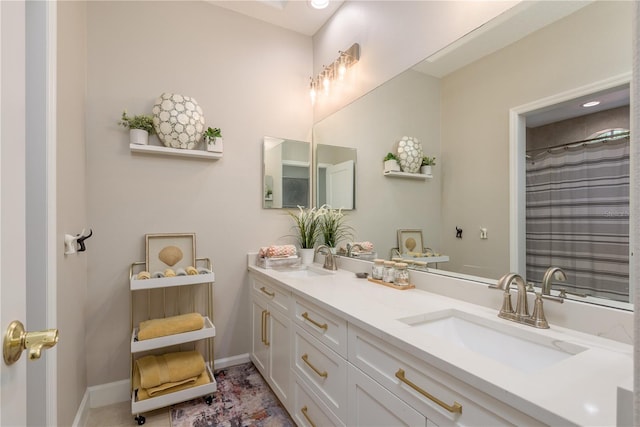 3042 Wentworth Way, Tarpon Springs, FL 34688 - bathroom with double vanity and baseboards