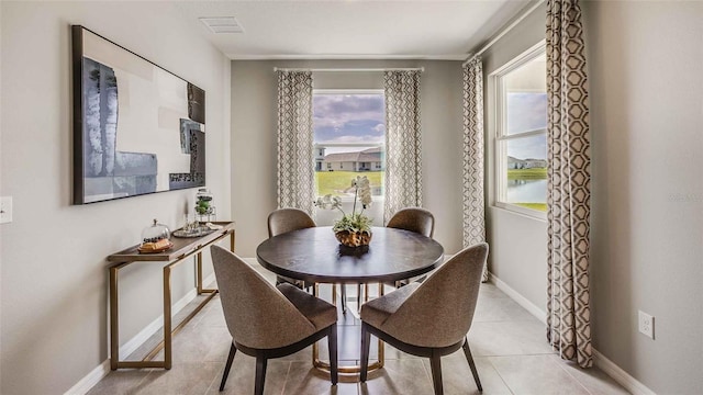 2637 Warren Acres Blvd, Wesley Chapel, FL 33543 - dining area featuring baseboards and light tile patterned floors