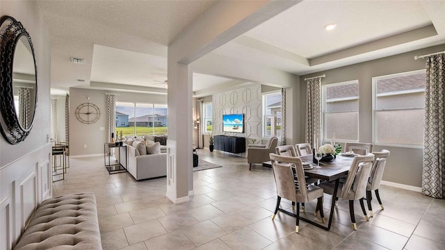 2637 Warren Acres Blvd, Wesley Chapel, FL 33543 - dining area with a raised ceiling and tile patterned flooring
