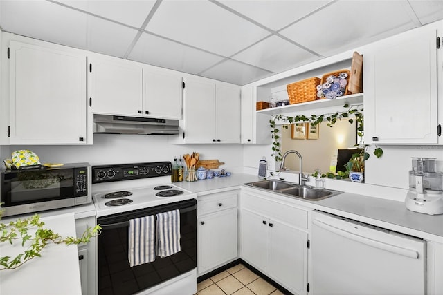 10351 Regal Dr Unit 24, Largo, FL 33774 - kitchen with range with electric stovetop, white dishwasher, stainless steel microwave, under cabinet range hood, and open shelves