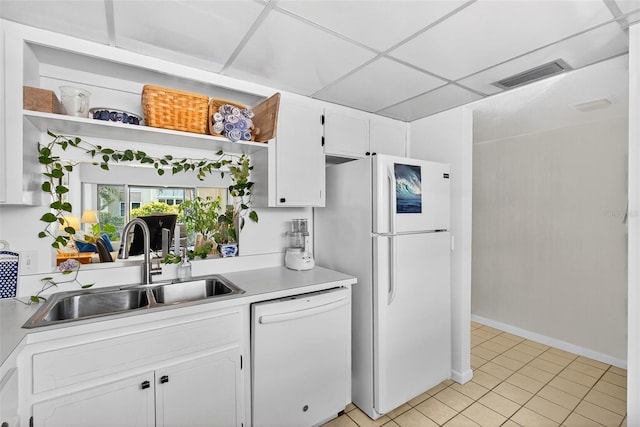 10351 Regal Dr Unit 24, Largo, FL 33774 - kitchen with white appliances, open shelves, light countertops, and white cabinetry