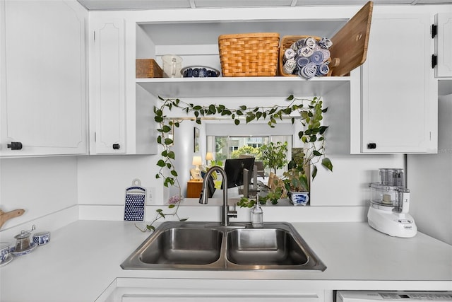 10351 Regal Dr Unit 24, Largo, FL 33774 - kitchen with open shelves, light countertops, and white cabinetry