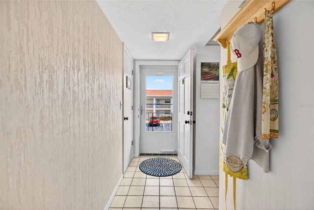 10351 Regal Dr Unit 24, Largo, FL 33774 - doorway to outside with a textured ceiling and light tile patterned flooring