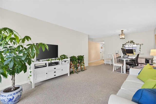 10351 Regal Dr Unit 24, Largo, FL 33774 - carpeted living area with an office area and baseboards