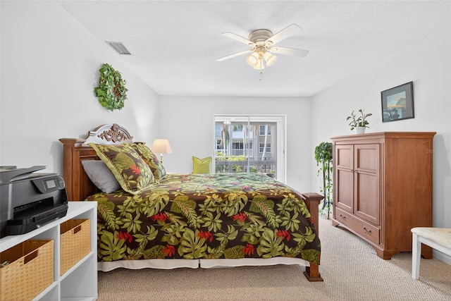 10351 Regal Dr Unit 24, Largo, FL 33774 - bedroom with light carpet, ceiling fan, and a textured ceiling