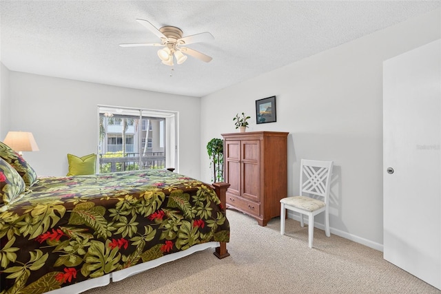 10351 Regal Dr Unit 24, Largo, FL 33774 - bedroom with light colored carpet, a textured ceiling, and ceiling fan