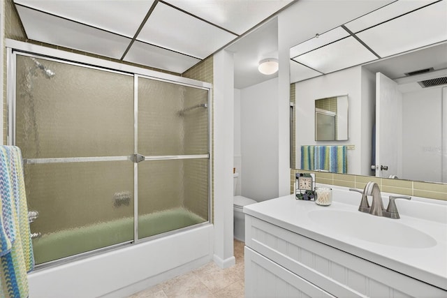 10351 Regal Dr Unit 24, Largo, FL 33774 - bathroom featuring bath / shower combo with glass door, vanity, and tile patterned floors